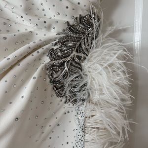 Monisha Jaising white one shoulder feather gown with leg slit